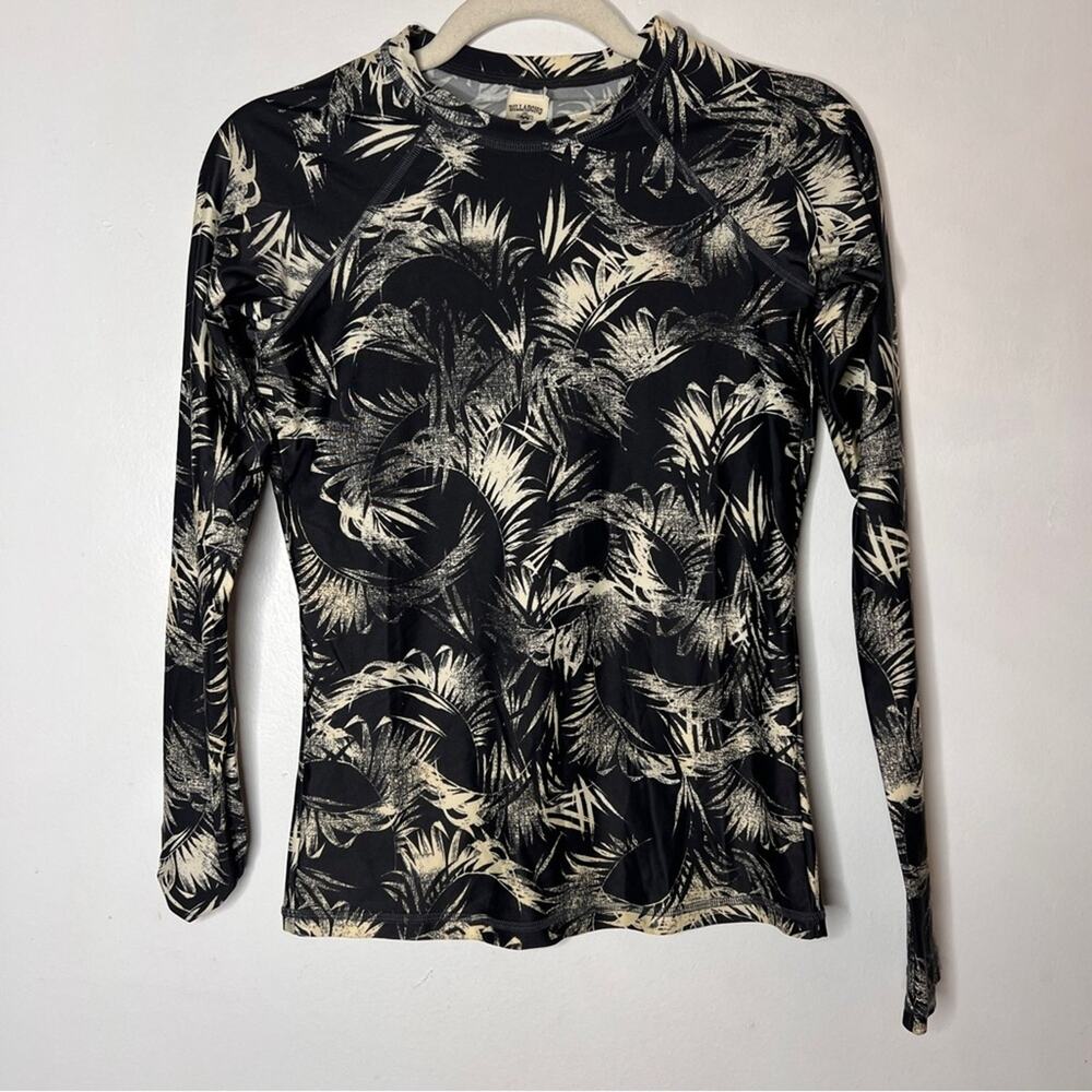 Billabong long-sleeve rashguard with a black and cream palm leaf print Size M